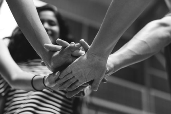 Group of teenager friends on a basketball court teamwork and togetherness concept