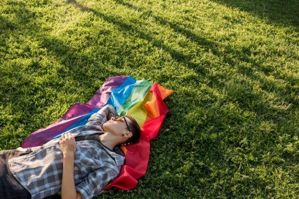 transgender-resting-green-meadow_23-2148163275